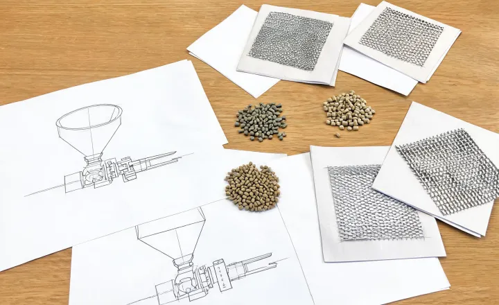 Interface sketch of hopper, extruder, screen changer, die and pellet cutter on a review table